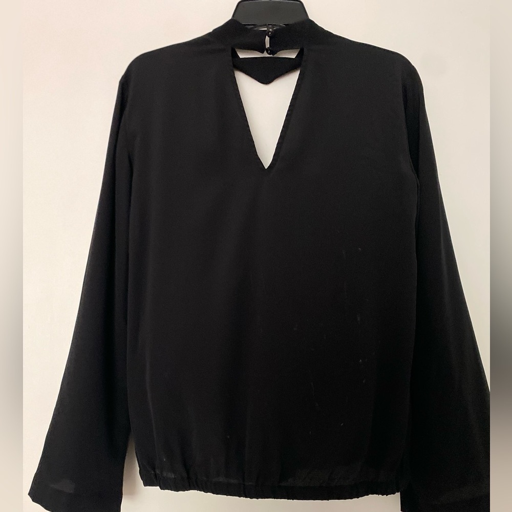 Trina Turk top, Black size M. 100% silk. Wrap front. Full sleeves. Choke collar.